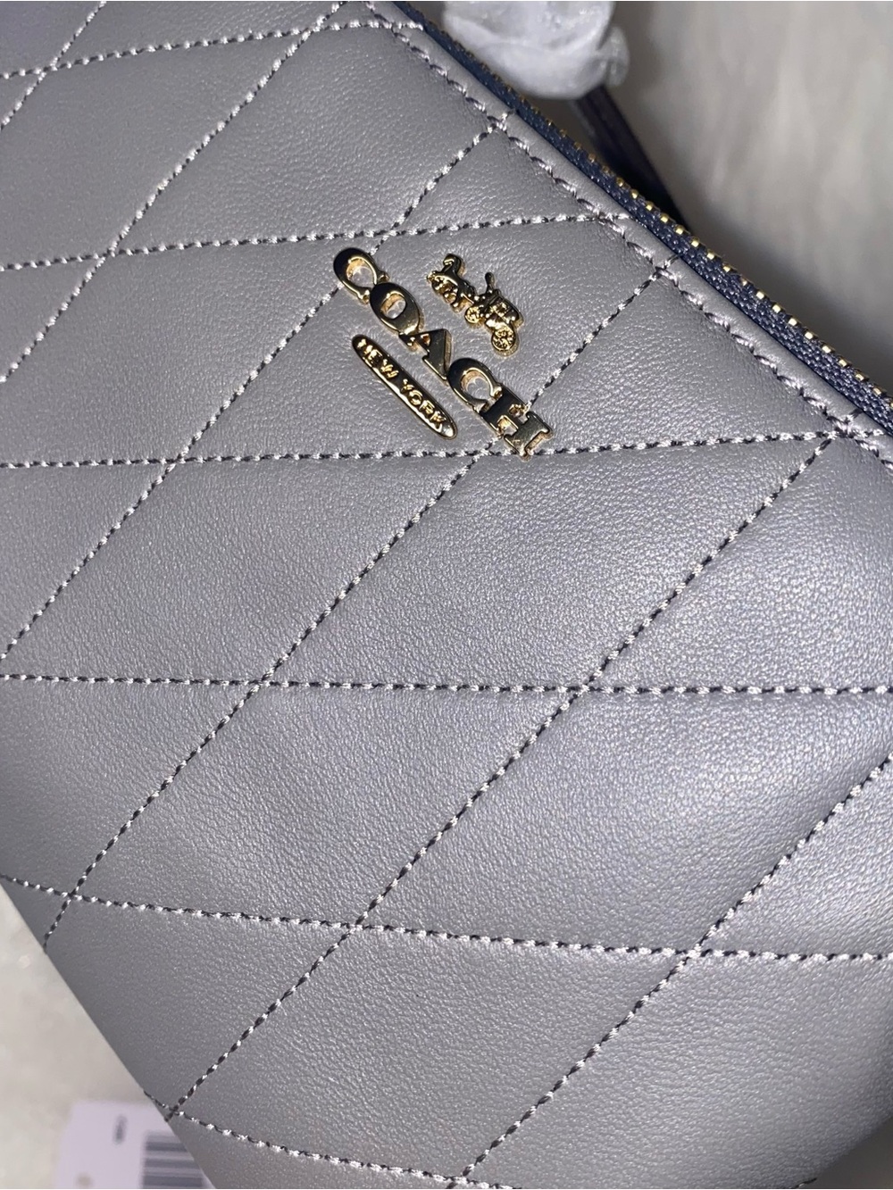 Coach Corner Zip Wristlet With Quilting
Slate color New with tags